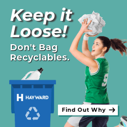 basketball player putting recycling in cart