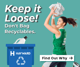 basketball player putting recycling in cart