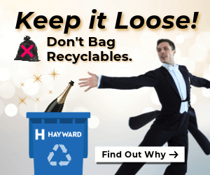 man throwing bottle in recycling